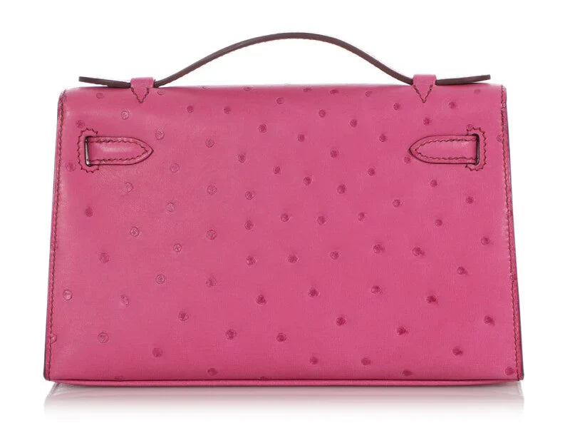 Fuchsia Ostrich Leather Mini Flap Handbag With Silver Turn Lock and Short Rolled Top Handle