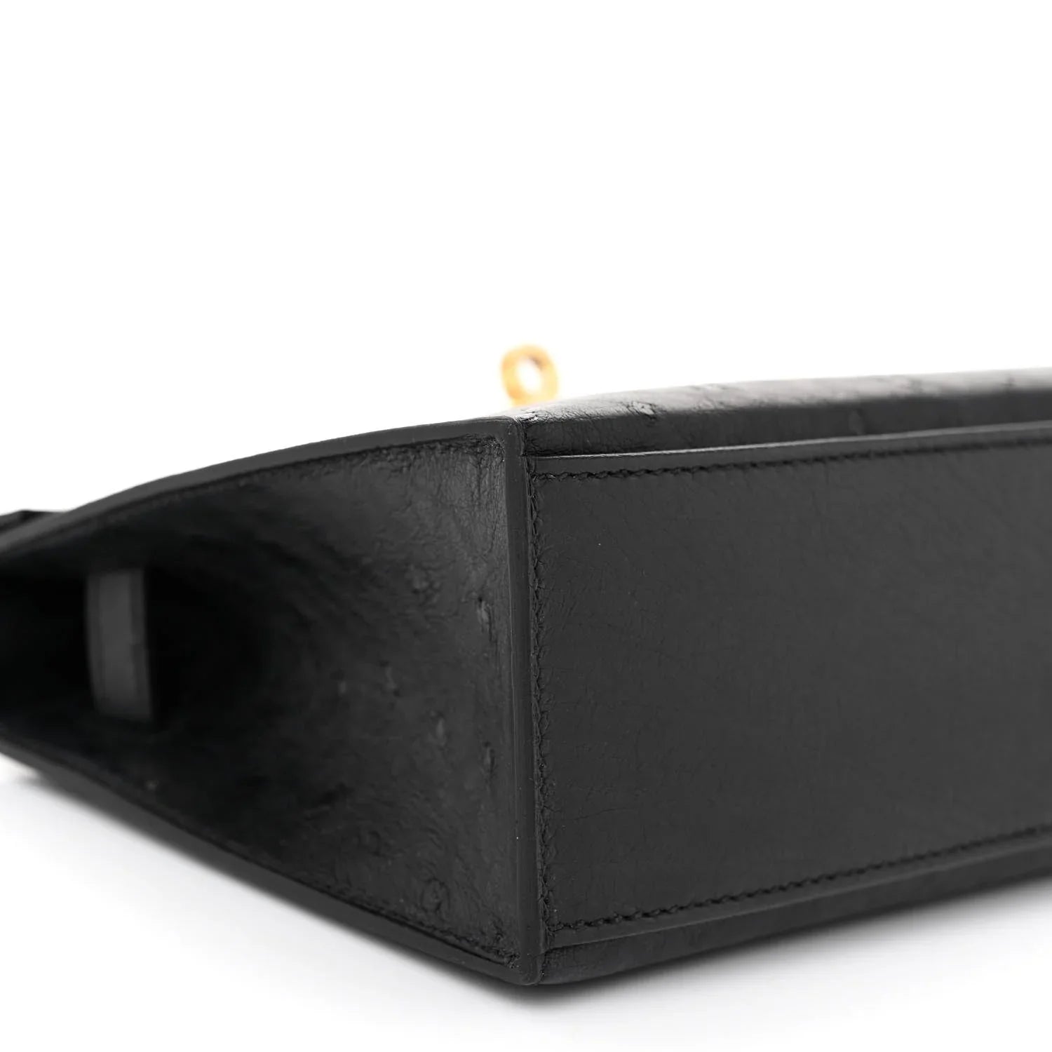 Sleek Black Ostrich Leather Mini Flap Handbag With Polished Gold Turn Lock and Short Slim Top Handle