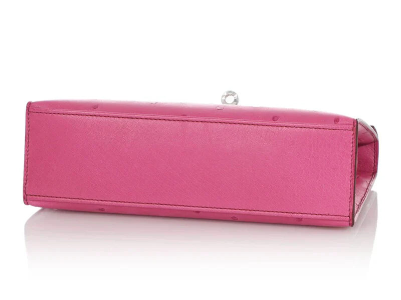 Fuchsia Ostrich Leather Mini Flap Handbag With Silver Turn Lock and Short Rolled Top Handle