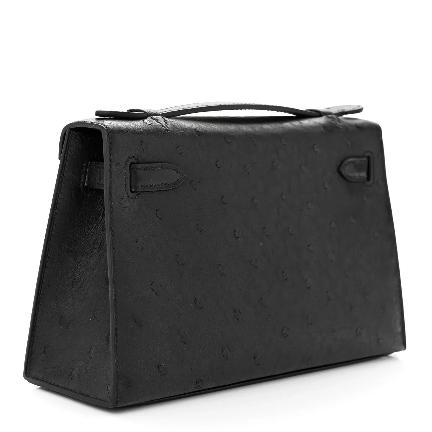 Sleek Black Ostrich Leather Mini Flap Handbag With Polished Gold Turn Lock and Short Slim Top Handle