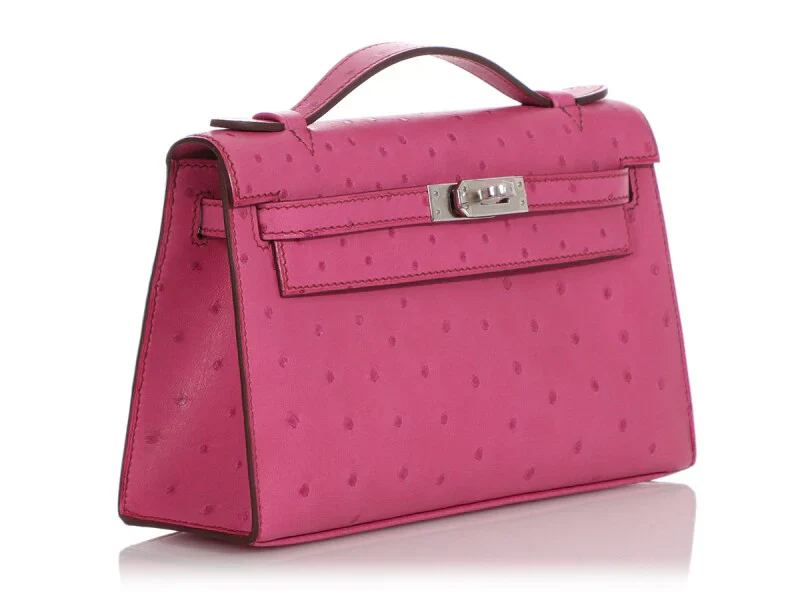 Fuchsia Ostrich Leather Mini Flap Handbag With Silver Turn Lock and Short Rolled Top Handle